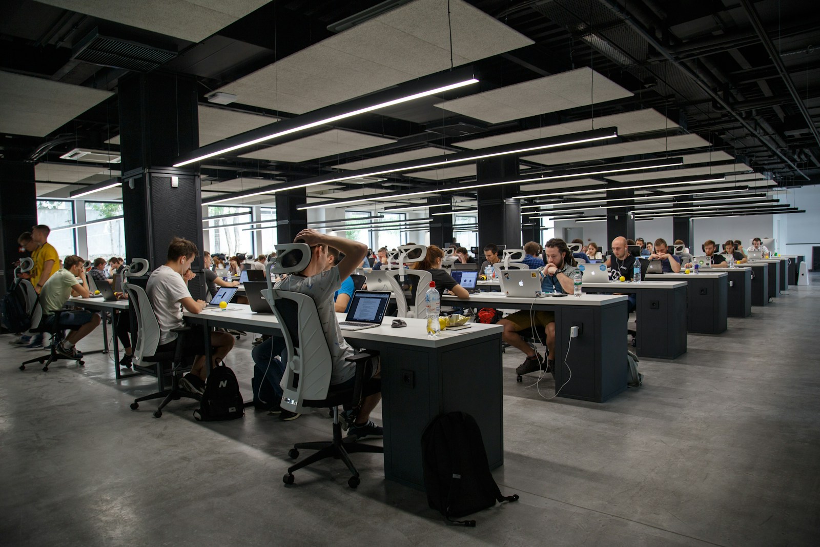 Learners practising AI income skills at a workshop table in Calgary