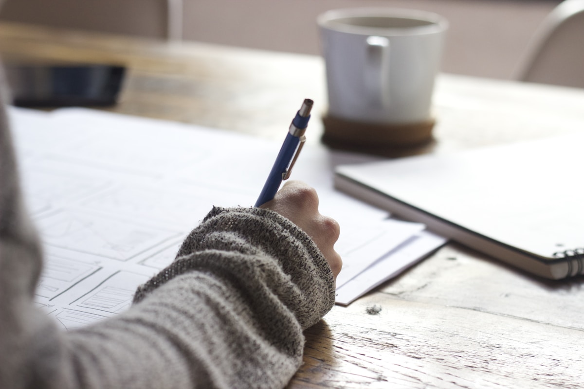 Income planning notebook and desk setup at Profit AI Lab